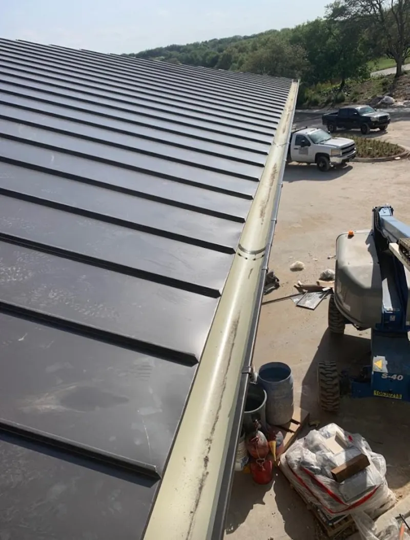 Standing seam panel and gutter detail on a metal roofing jobsite in East Kapolei